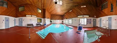 a swimming pool in a large room with a wooden ceiling at Americas Best Value Inn & Suites-East Bakersfield in Bakersfield