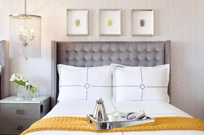 a bedroom with a bed with a silver tray on it at Huntley Santa Monica Beach in Los Angeles
