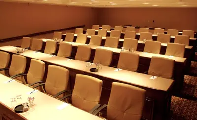 a conference room with a row of tables and chairs at Ontario Airport Hotel & Conference Center in Ontario