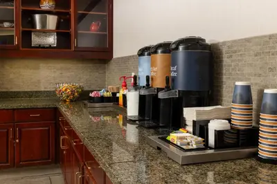 a kitchen counter with a coffee maker on it at Homewood Suites by Hilton Ontario Rancho Cucamonga in Rancho Cucamonga