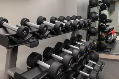 a row of dumbbells in a gym at Homewood Suites by Hilton Ontario Rancho Cucamonga in Rancho Cucamonga