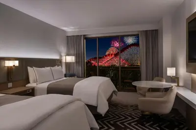 a hotel room with two beds and a view of the wheel at The Westin Anaheim Resort in Anaheim