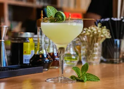 a drink in a martini glass sitting on a table at Hotel Ziggy On Sunset in Los Angeles