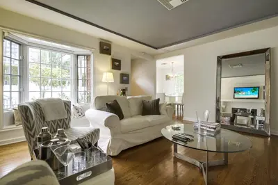 a living room with a couch and a table at A Touch of Cape Cod in West Hollywood in Los Angeles