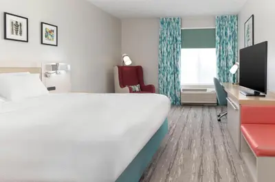 a hotel room with a bed and a tv at Hilton Garden Inn Ontario Rancho Cucamonga in Rancho Cucamonga