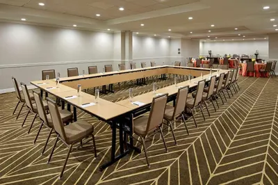 a large conference room with a long table and chairs at Hilton Pasadena in Pasadena