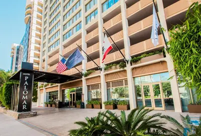 a hotel with flags in front of a building at Kimpton Hotel Palomar Los Angeles Beverly Hills by IHG in Los Angeles