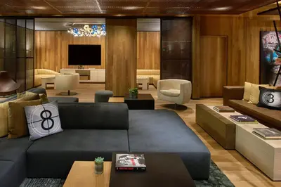 a living room with a couch and a tv at Kimpton Hotel Palomar Los Angeles Beverly Hills by IHG in Los Angeles