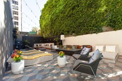 a patio with couches and chairs on a patio at Kimpton Hotel Palomar Los Angeles Beverly Hills by IHG in Los Angeles