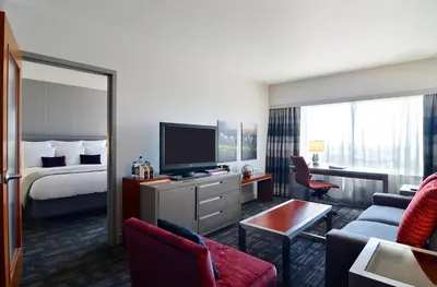 a hotel room with a bed and a television at Loews Hollywood Hotel in Los Angeles