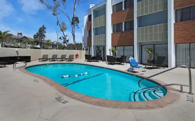 a swimming pool in front of a building at Holiday Inn Express Port Hueneme by IHG in Port Hueneme