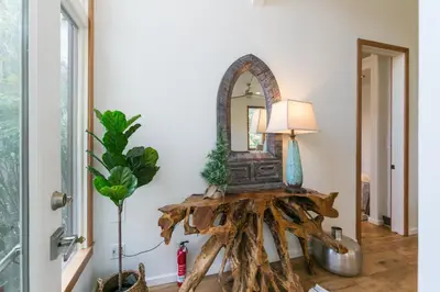 a mirror on a table in a room with a lamp at Stunning 2-Bedroom Home near Downtown Culver in Los Angeles