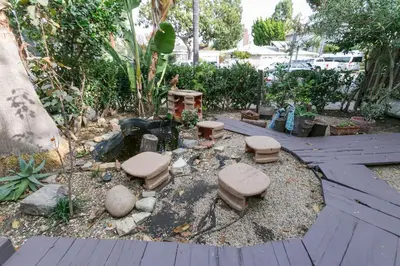 a garden with a group of stools in a yard at Stunning 2-Bedroom Home near Downtown Culver in Los Angeles