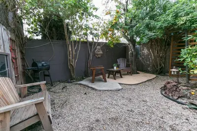a backyard with a fire pit and a fence at Charming 1-Bedroom Home near Downtown Culver in Los Angeles