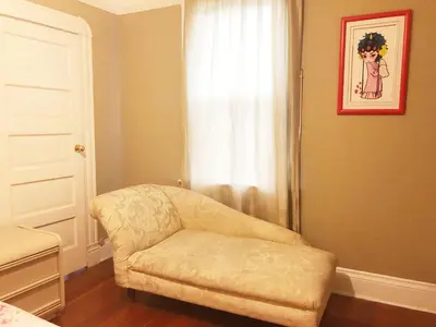 a living room with a chair and a window at Cozy Suite near City of hope in Duarte