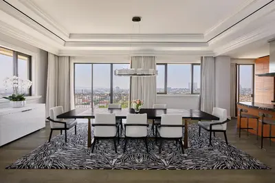 a dining room with a table and chairs at Beverly Wilshire, Beverly Hills, A Four Seasons Hotel in Los Angeles