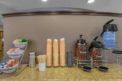 a kitchen counter with a bunch of food and utensils at Comfort Suites Ontario Airport Convention Center in Ontario