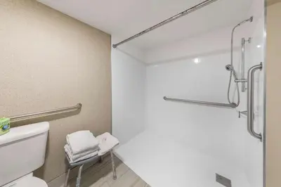 a bathroom with a shower and a toilet and a sink at Quality Inn & Suites Camarillo-Oxnard in Camarillo