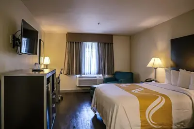 a hotel room with a large bed and a window at Quality Inn & Suites Camarillo-Oxnard in Camarillo