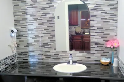 a bathroom with a sink and a mirror at Viking Motel-Ventura in Ventura