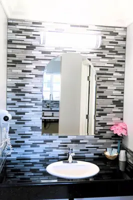 a bathroom with a sink and a mirror at Viking Motel-Ventura in Ventura