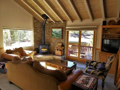 a living room with couches and a fire place at Dream Getaway-Secluded Hot Spa-Walk to Village-Walk to Pineknot Trailhead-Plus King Bed! in Big Bear Lake