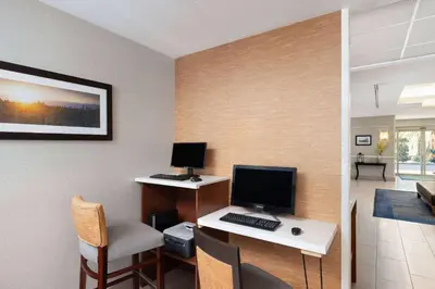a room with a desk with a computer on it at La Quinta by Wyndham Bakersfield North in Bakersfield