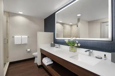 a bathroom with a sink and a mirror at Hyatt Regency Westlake in Westlake Village