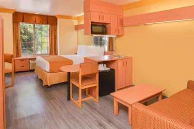 a hotel room with a bed and a table at H3 Inn & Suites - LAX Airport - Los Angeles in Inglewood