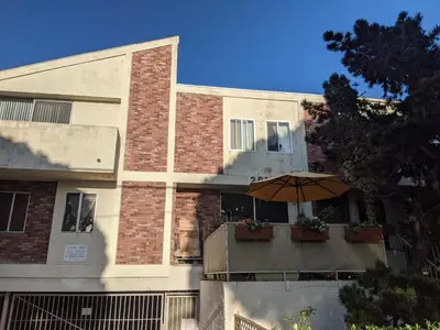 a building with an umbrella in front of it at 2Bedroom with Den and 2BA 4 Blocks to Santa Monica Beach in Los Angeles