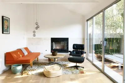 a living room with a couch and a chair at Venice Place in Los Angeles
