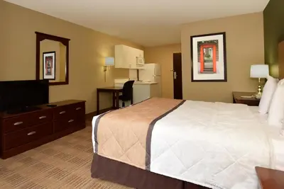 a hotel room with a bed and a television at Extended Stay America Suites - Orange County - Anaheim Convention Center in Anaheim