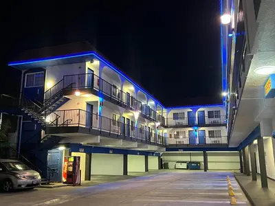 a building with blue lights on it at night at Cloud 9 Inn LAX in Inglewood