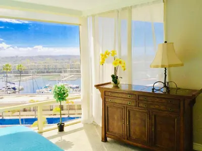 a bedroom with a large window with a view of a harbor at Fantastic Marina View in Front of My Window! in Los Angeles