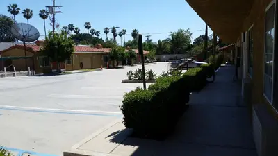 a sidewalk next to a building with a street at Economy Inn Motel in Sylmar