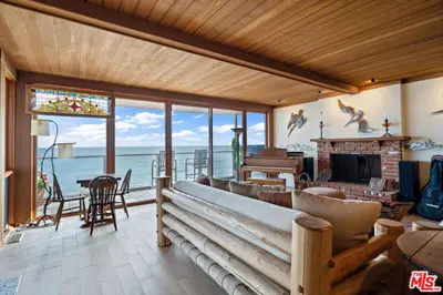 a living room with a couch and a fireplace at Villa Rylee in Malibu