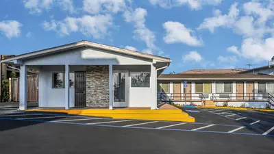 a rendering of a building in a parking lot at Sea Rock Inn - Long Beach in Long Beach