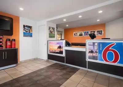 a room with two large televisions in a store at Motel 6-Buena Park, CA - Knotts Berry Farm - Disneyland in Buena Park