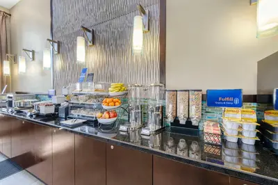 a buffet line in a restaurant with food at Best Western Oxnard Inn in Oxnard