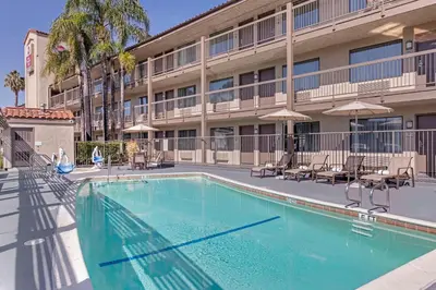 a swimming pool in front of a hotel at Best Western Plus Executive Inn Rowland Height City of Industry in Rowland Heights