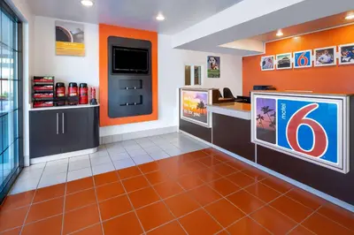 a waiting room with a large flat screen tv at Motel 6-Carpinteria, CA - Santa Barbara - South in Carpinteria