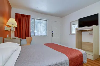 a hotel room with a bed and a television at Motel 6-Big Bear Lake, CA in Big Bear Lake