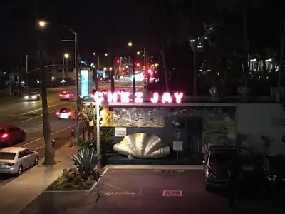 a truck parked in a parking lot at night at Ocean Lodge Santa Monica Beach Hotel in Los Angeles