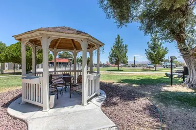 a gazebo with a table and chairs in a park at Quality Inn Barstow Route 66 in Barstow