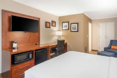 a hotel room with a bed and a flat screen tv at Comfort Inn Santa Monica - West Los Angeles in Los Angeles