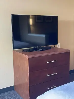 a television on top of a dresser in a room at Baymont by Wyndham Ontario in Ontario