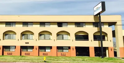 a building with a street sign in front of it at Baymont by Wyndham Ontario in Ontario