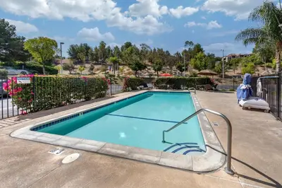 a swimming pool at a resort at Comfort Suites Near Six Flags Magic Mountain in Stevenson Ranch