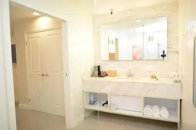 a bathroom with a sink and a mirror at Hotel Le Reve Pasadena in Pasadena