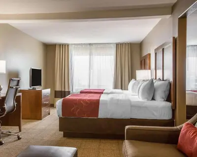 a hotel room with a bed and a television at Comfort Suites Victorville-Hesperia in Victorville